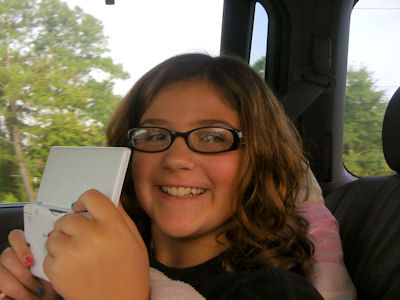 Maddy entertains herself with Nitendo DS